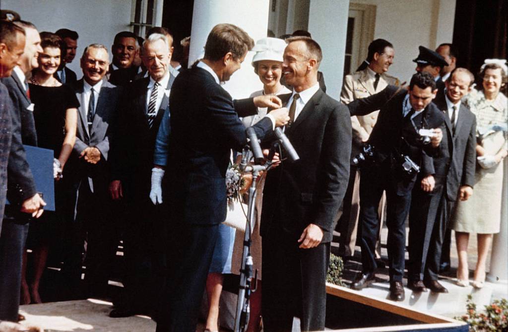 President John F. Kennedy pins NASA's Distinguised Service Medal on the jacket of Astronaut Alan B. Shepard Jr.