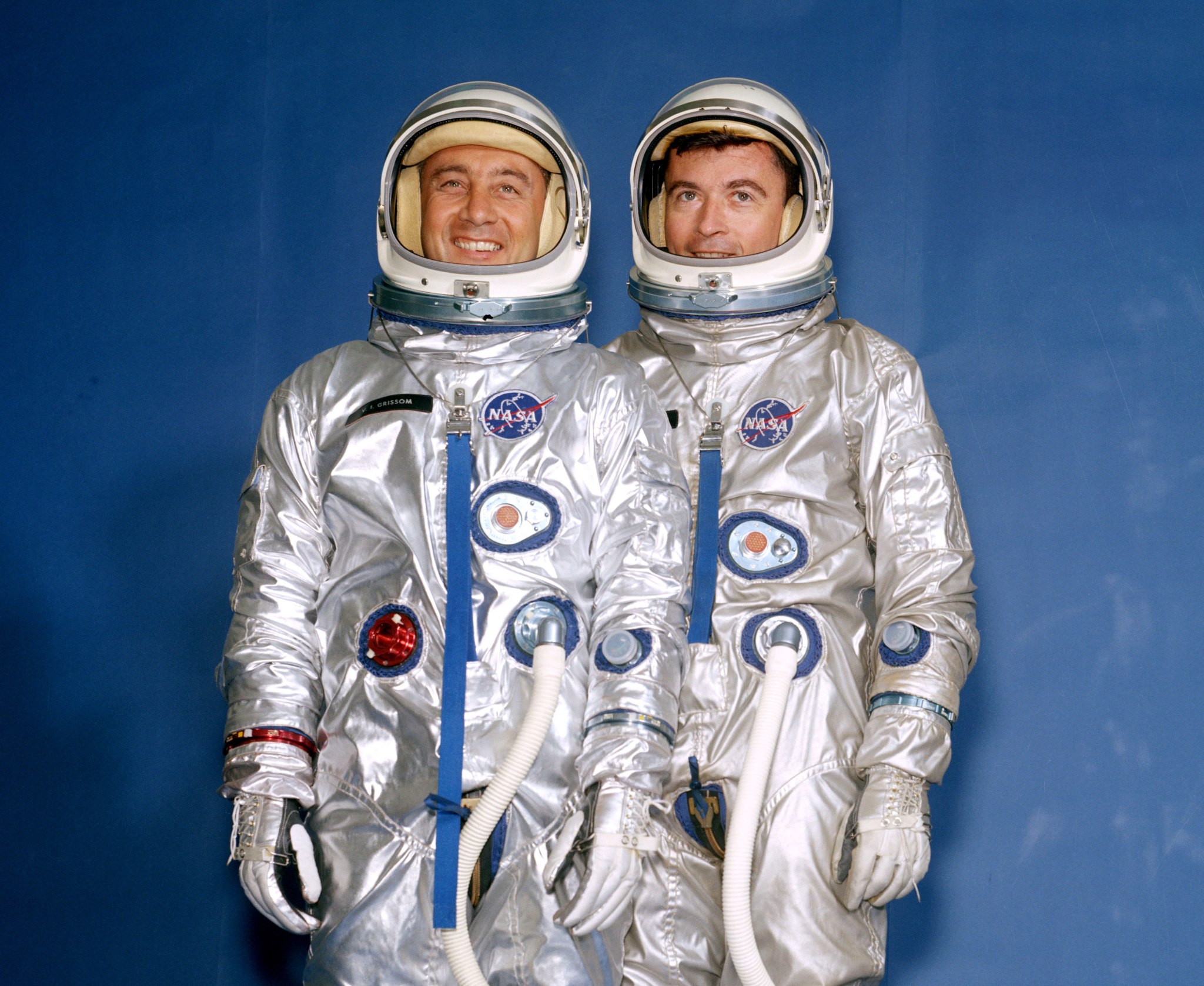 Gus Grissom and John Young in silver spacesuits from the Gemini program
