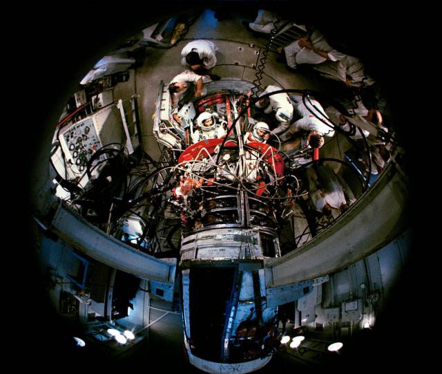 Fisheye view of Gemini spacecraft with two astronauts inside