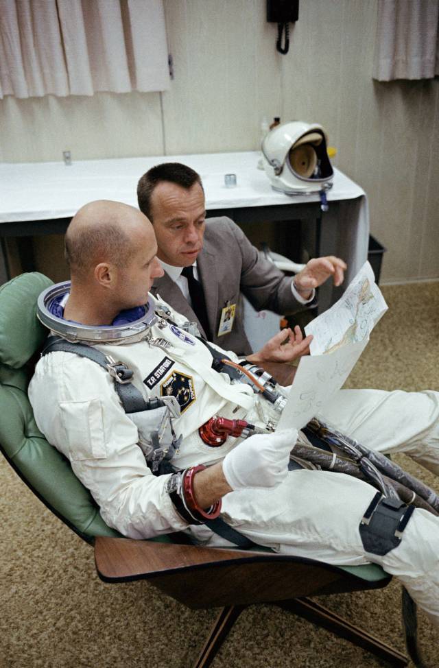 Astronauts Thomas P. Stafford (foreground), Gemini-6 prime crew pilot; and Alan B. Shepard Jr., chief, Astronaut Office, Manned 