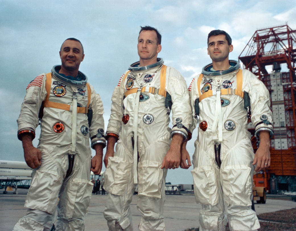 Apollo 1 prime crew in spacesuits pose for portrait during training outside in Florida