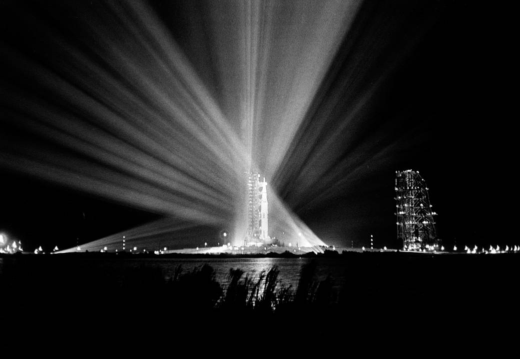 Nighttime view of Saturn rocket on launchpad