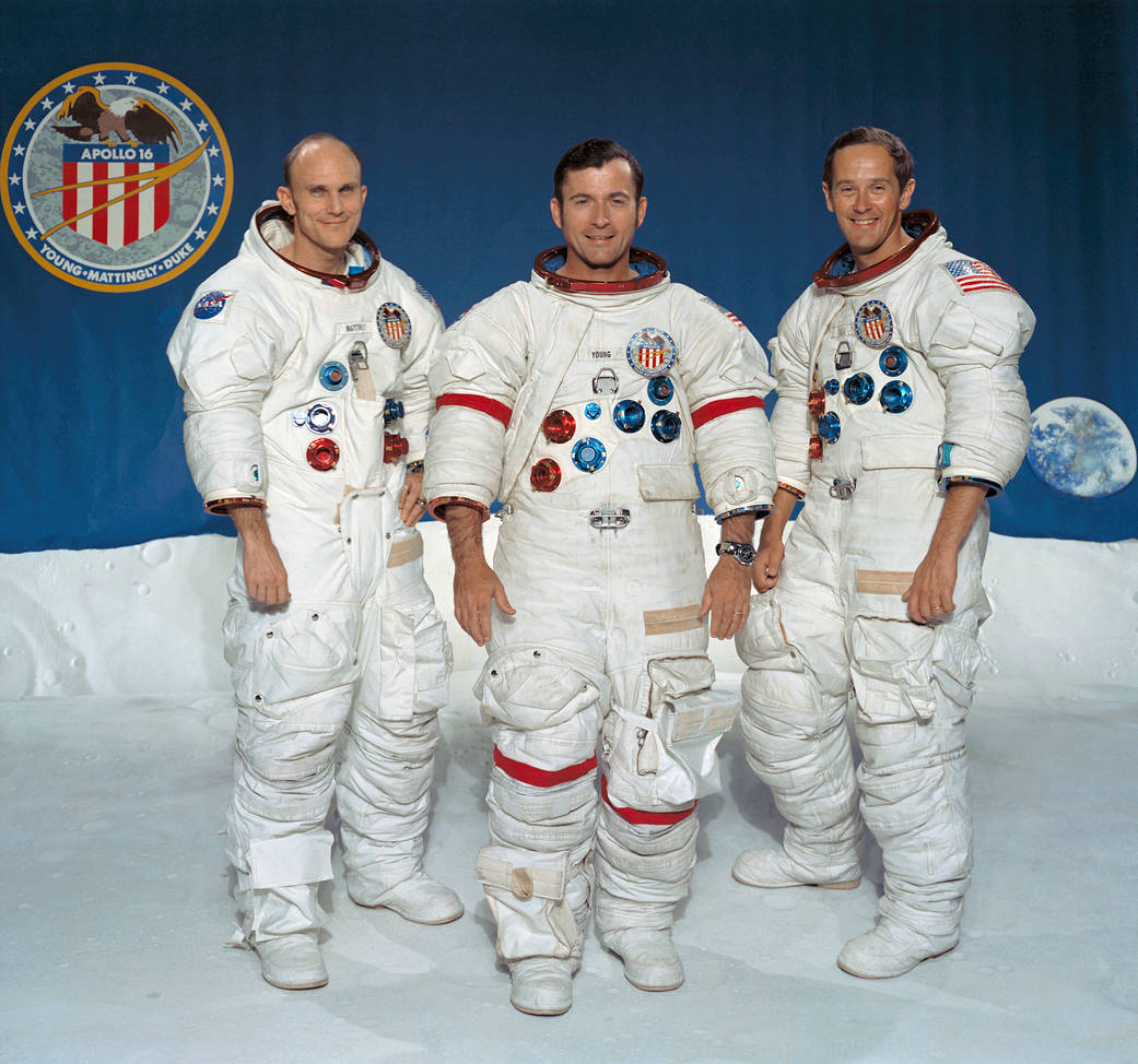 Crew portrat of three astronauts in spacesuits