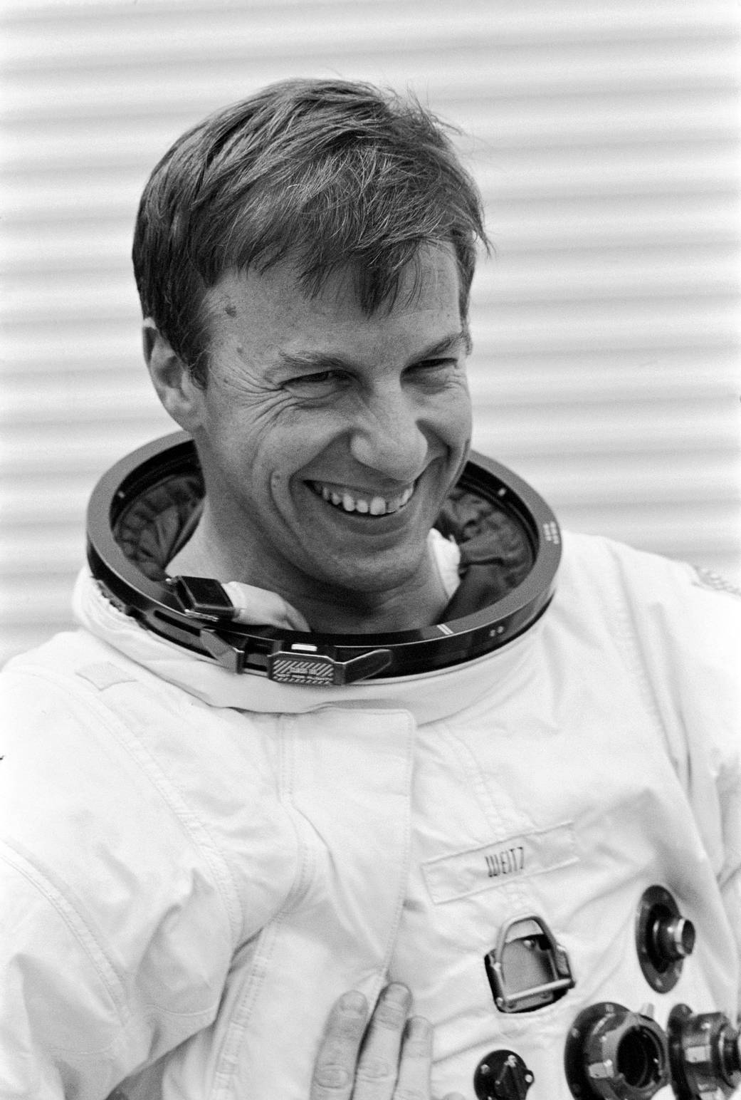 Astronaut Paul Weitz in spacesuit without helmet smiles