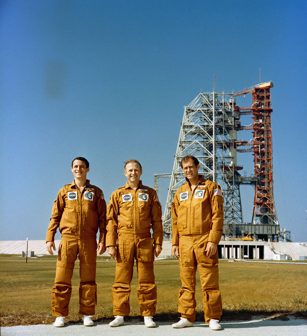 The three members of the Skylab 4 crew are photographed standing near Pad B, Launch Complex 39, Kennedy Space Center, Florida, d