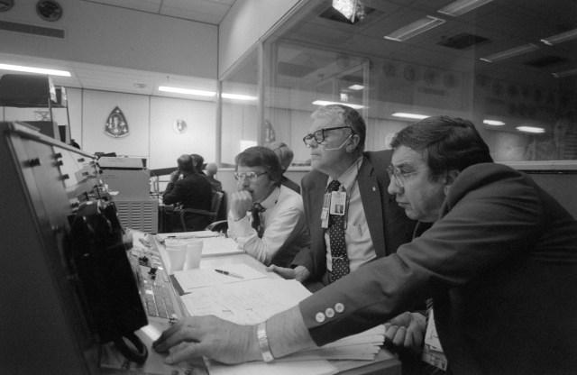 Pictured in the Mission Operation Control Room during the STS-6 Extravehicular Activity are Milt Silveira (right), Special Assistant to the NASA Deputy Administrator Hans Mark (center). 7 April 1983