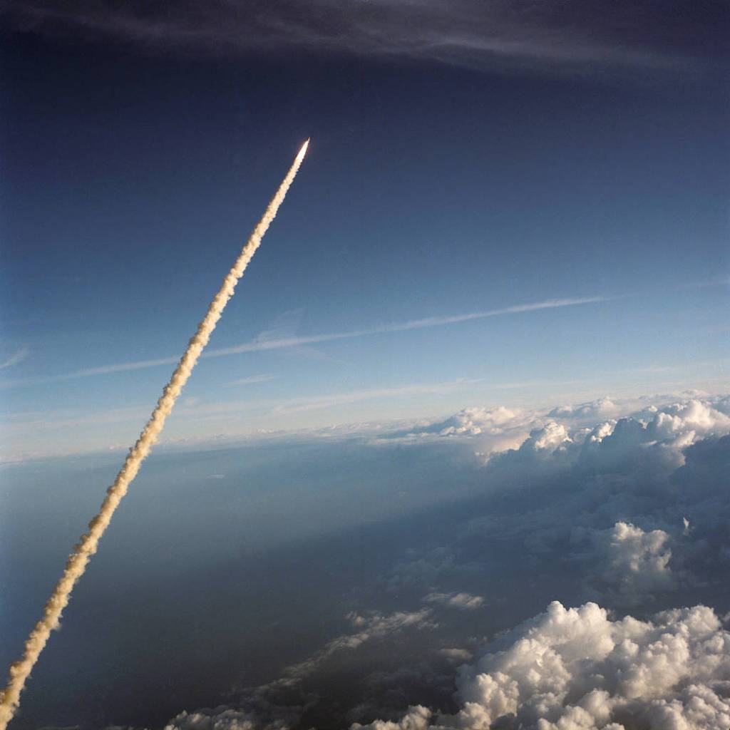 Trail of smoke as shuttle launches through atmosphere