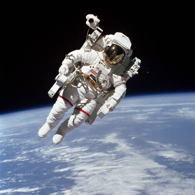 Astronaut in spacesuit performs spacewalk untethered