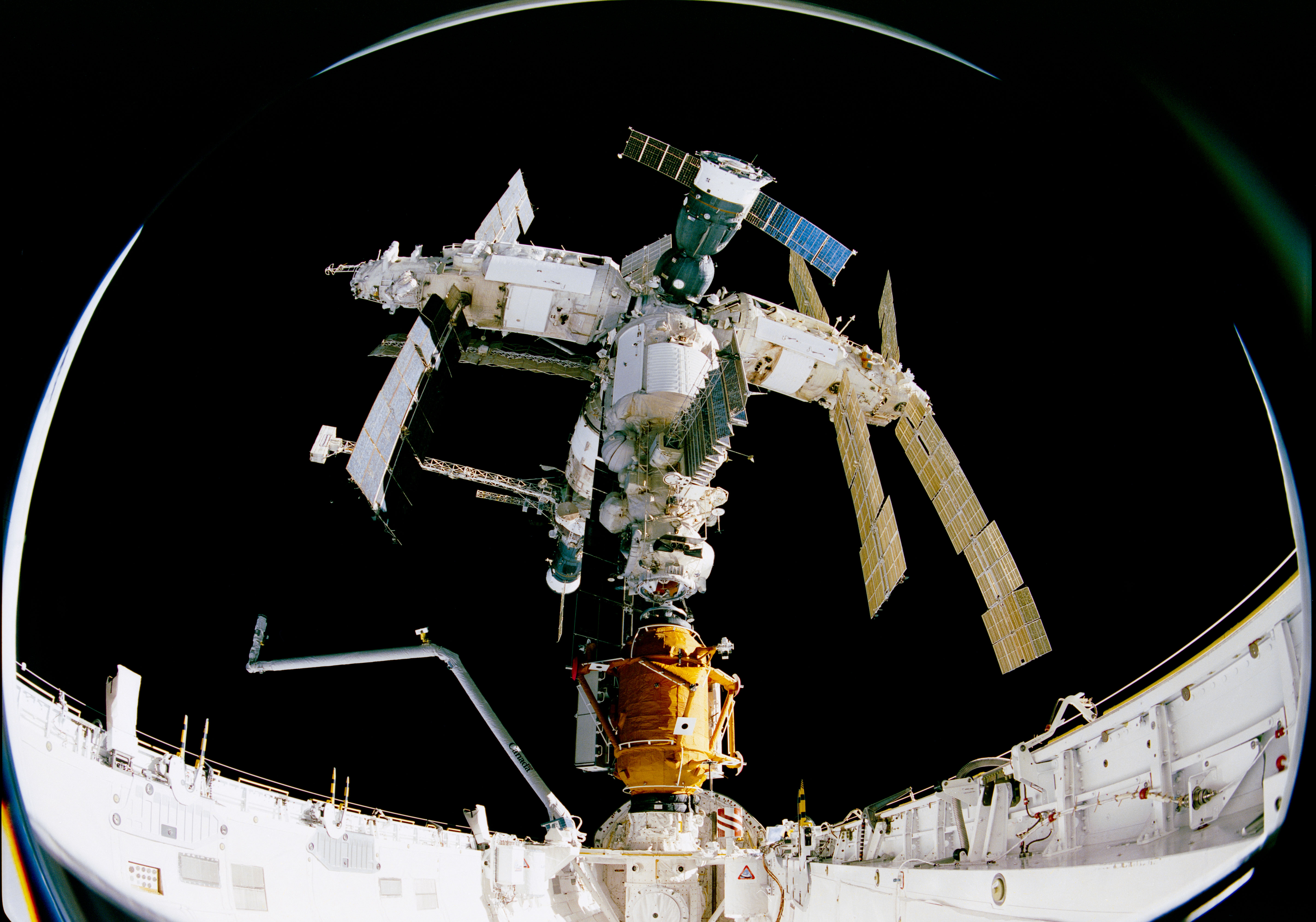 STS-74 crew members used an IMAX camera to document the Space Shuttle Atlantis' rendezvous and docking with the Mir Space Station.