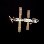 Space station with solar arrays deployed.