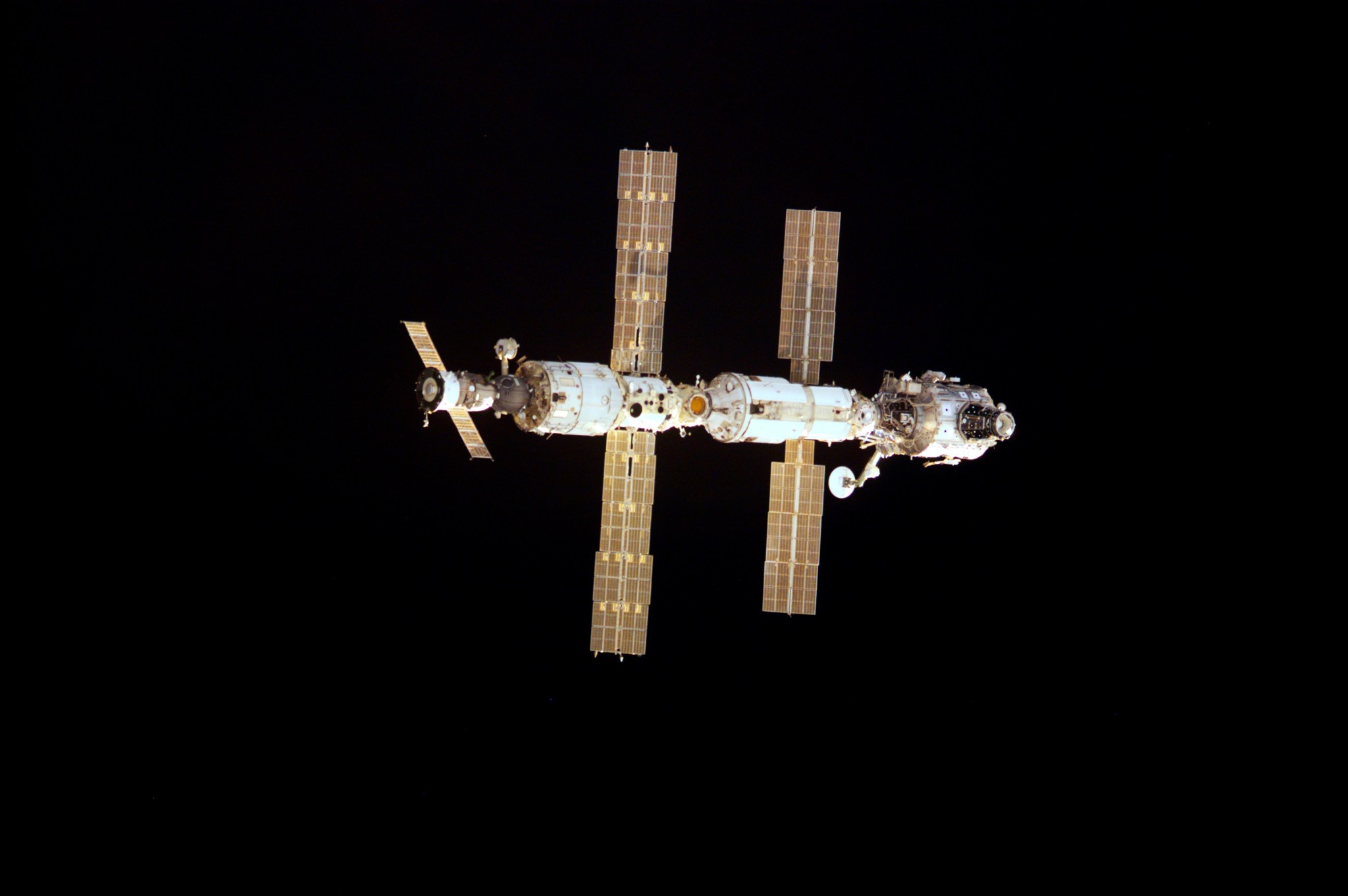Space station with solar arrays deployed.
