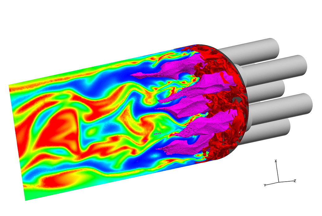 In this visualization, isosurfaces of the fuel (red) and oxygen (magenta) are shown entering the combustion chamber, with red re
