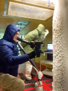 Scientific imaging specialist Quentin Schwinn uses a laser scanner to scan ice accretion on the leading edge of an airfoil.