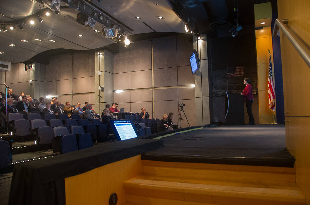 People listen to a talk