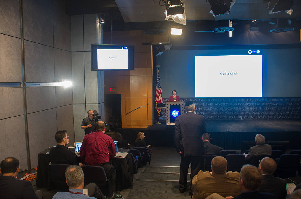 People listen to a talk