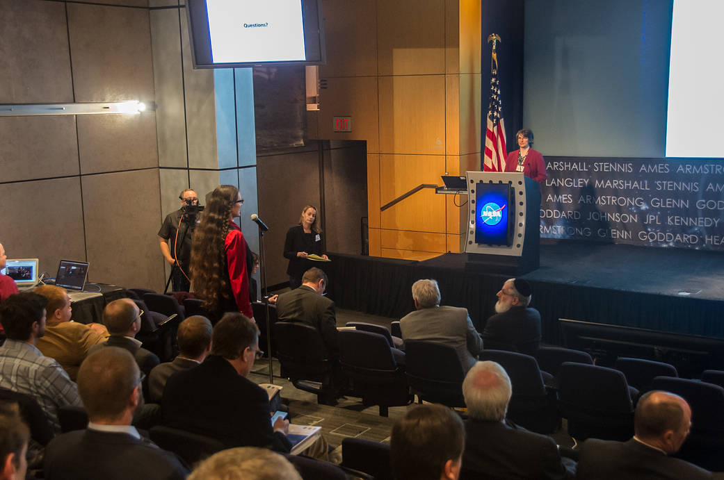 People listen to a talk