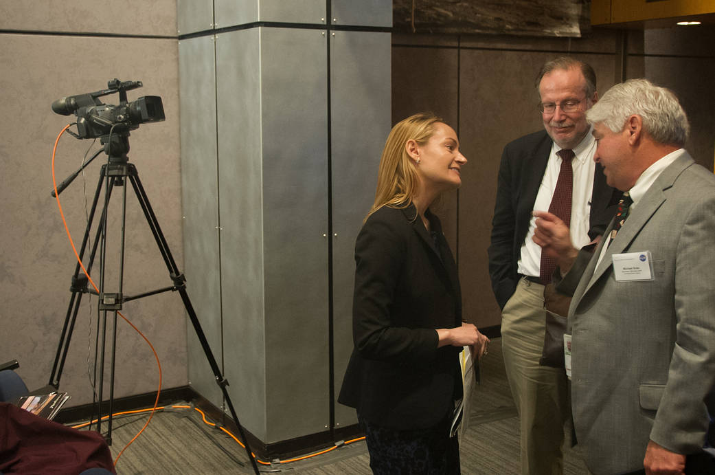 Three people talking