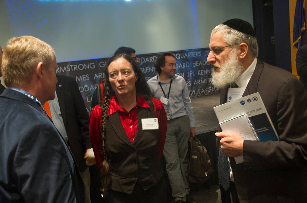 Three people talking