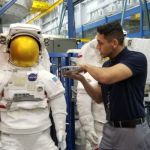 Pathways Intern looking at NASA Space Suit