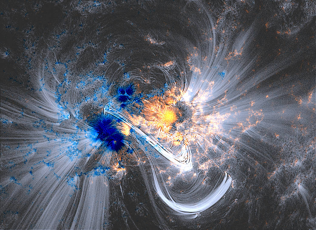 Closeup of coronal loops in bright color on surface of sun