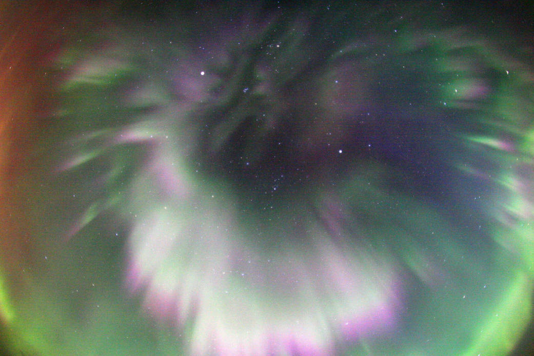 This colorful example of spectacular curtains of aurora was captured with a fish-eye lens in skies over Quebec, Canada on Septem