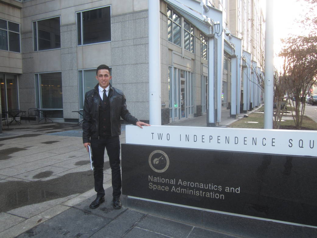Colorado Space Grant student Andrez Leyva in front of the NASA HQ entrance