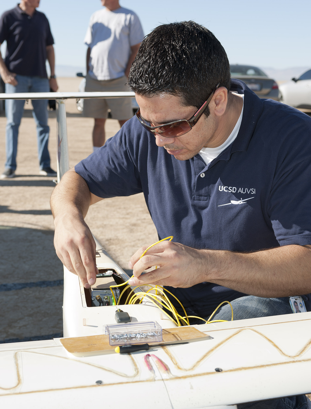 Benjamin Martins works on APV-3 aircraft with instrumented wings