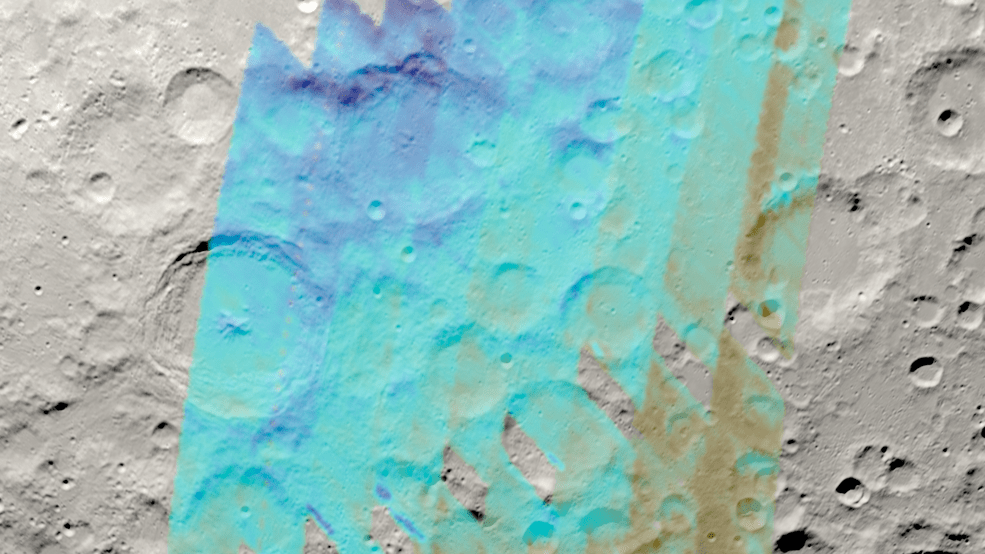 Data shown in shades of blue and brown is overlaid on a visualization of the Moon's surface with craters of various sizes. Dark blue lines the inner rim of a large crater at center left and one slope of a horizontal ridge near center top.