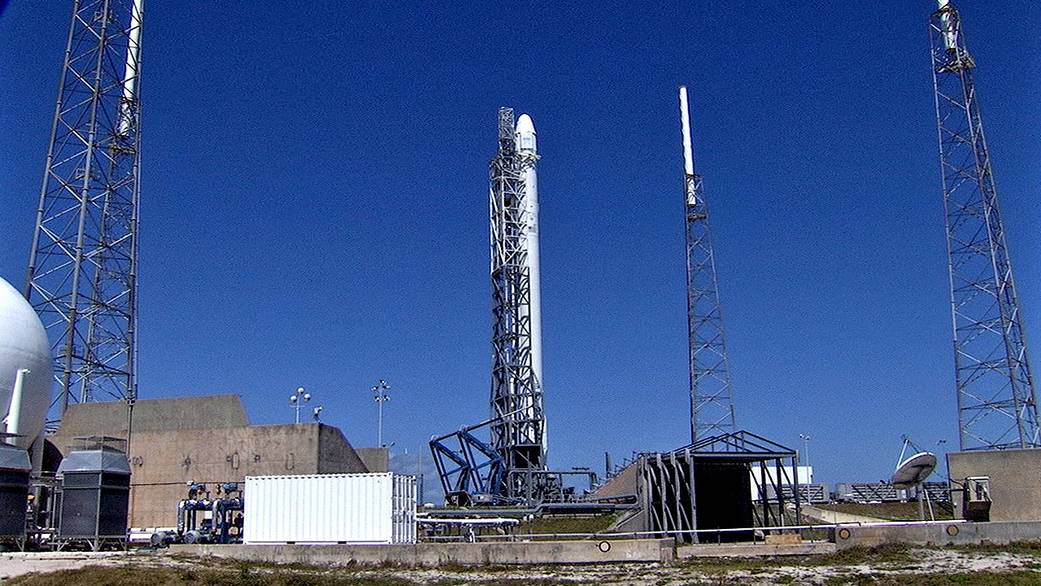 The SpaceX Falcon 9 rocket stands on the launch pad