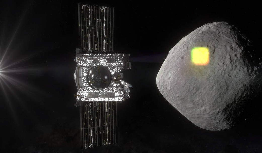 spacecraft projecting light onto asteroid