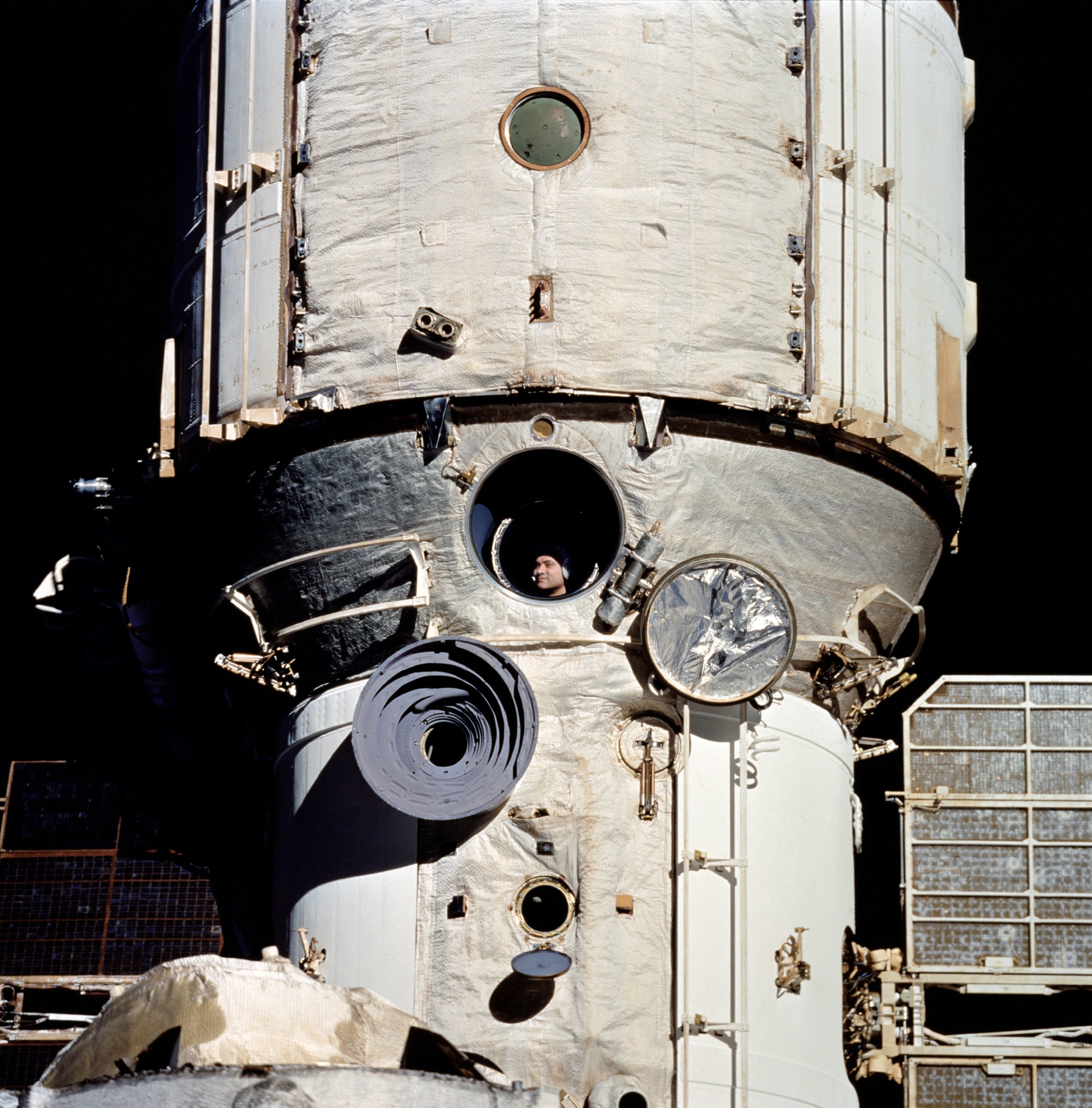 Cosmonaut Valeriy V. Polyakov, who boarded Russia's Mir space station on January 8, 1994, looks out Mir's window during rendezvous operations with wth Space Shuttle Discovery during the STS-63 mission.