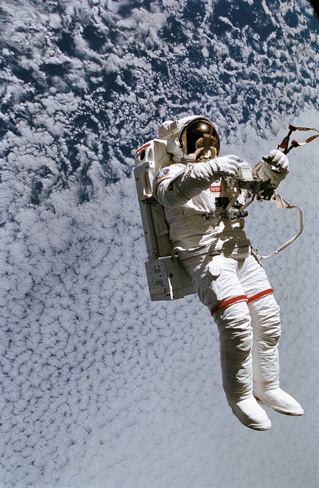 Astronaut on untethered spacewalk with Earth below