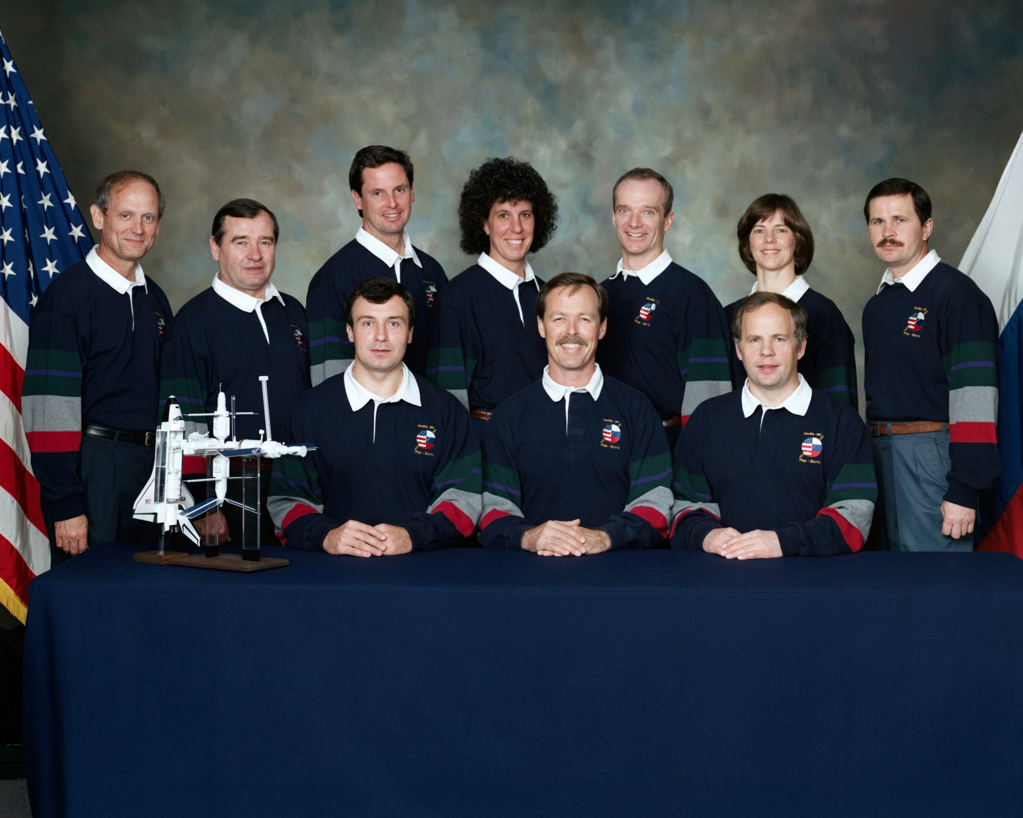 Crew members for the STS-71 mission and the related Mir missions assembled for a crew portrait at JSC. In front are, left to right, Vladimir N. Dezhurov, Robert L. Gibson and Anatoliy Y. Solovyev, mission commanders for Mir-18, STS-71 and Mir-19, respectively. On the back row are, left to right, Norman E. Thagard, Gennadiy M. Strekalov, Gregory J. Harbaugh, Ellen S. Baker, Charles J. Precourt, Bonnie J. Dunbar and Nikolai M. Budarin.