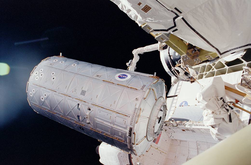 In this Feb. 10, 2001 photo, the Destiny laboratory is moved by the shuttle's remote manipulator system (RMS) robot arm from its