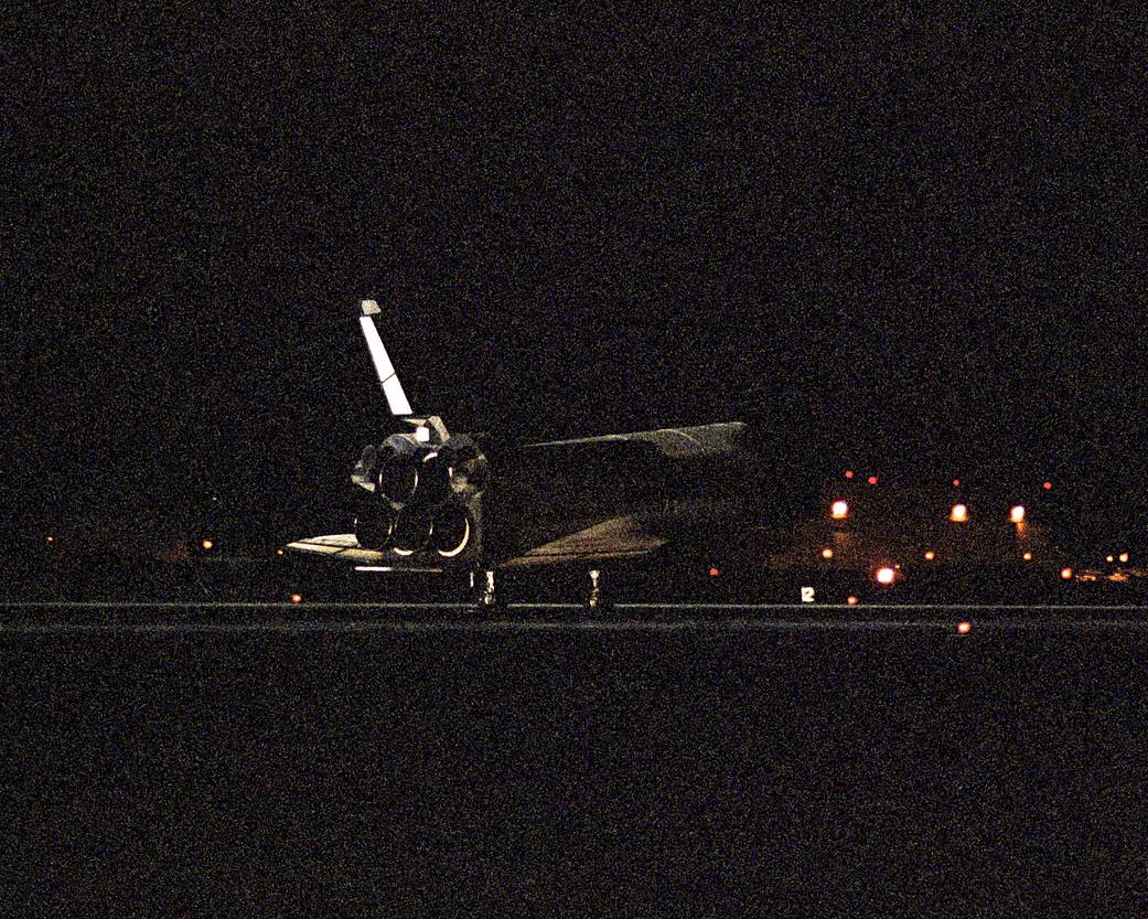 Shuttle lands on runway at night