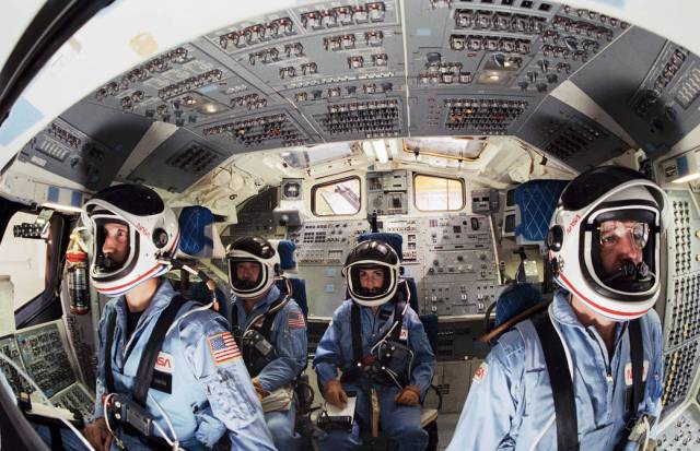 The crew of STS-51L in the Flight Deck on December 17, 1985