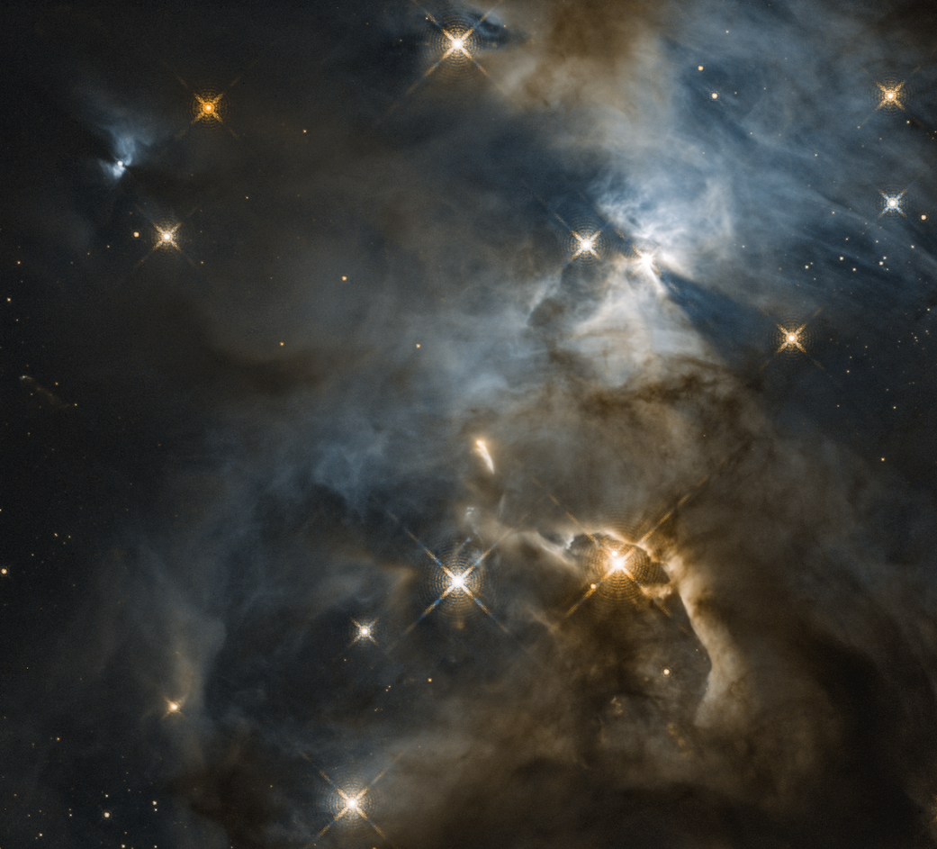 murky nebula with bright stars