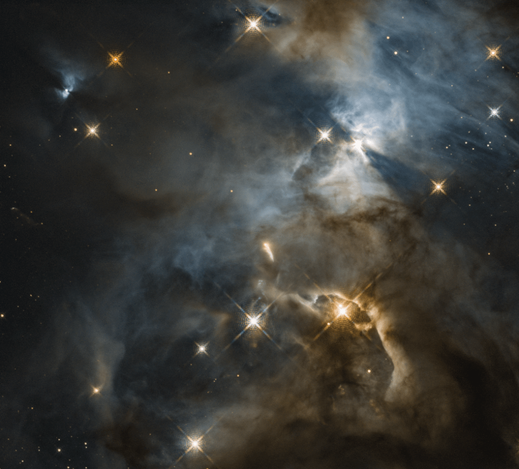 murky nebula with bright stars