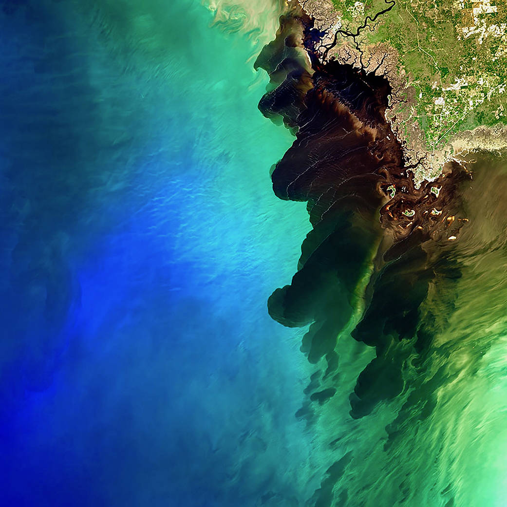 a large river discharge event, which resulted in a mesmerizing dark river plume contrasting with the deep blue color of the Gulf