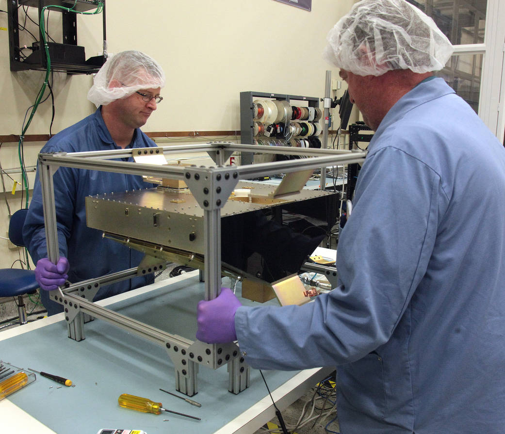 SwRI technicians assemble and integrate CYGNSS microsatellite engineering model