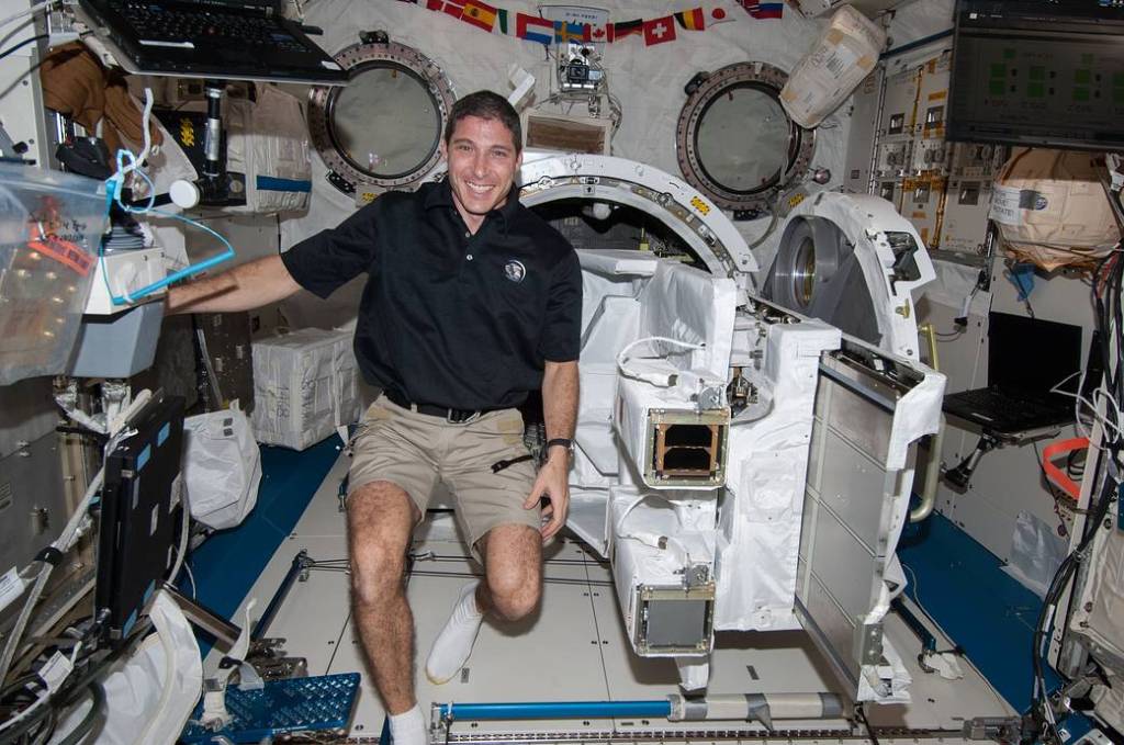 American astronaut Michael Hopkins next to the J-SSOD containing TechEdSat-3