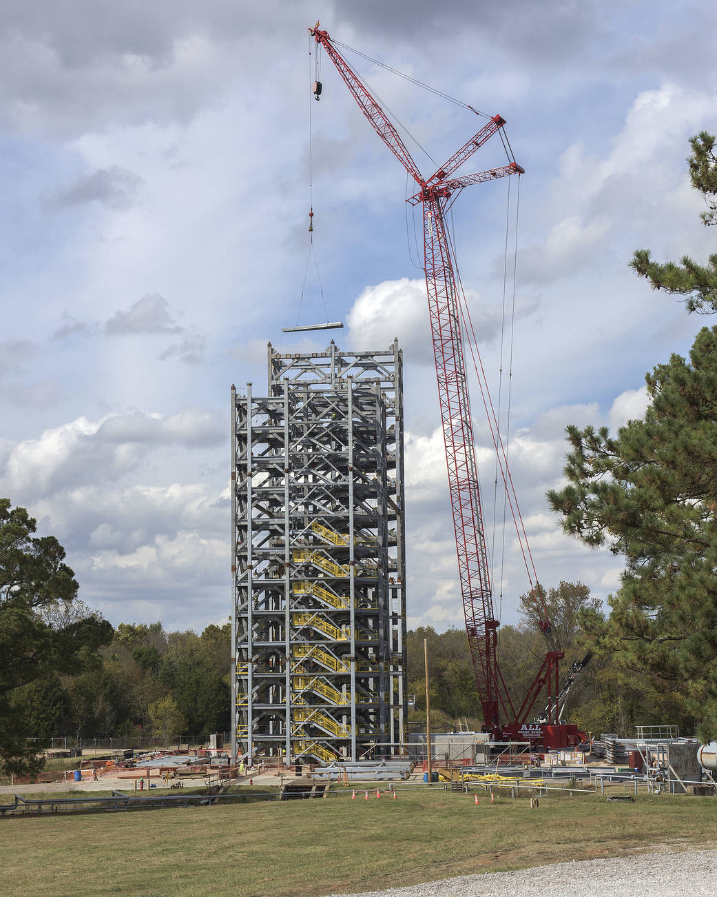 Steel is rising for two towers that will compose a 215-foot-tall structural test stand for NASA's Space Launch System.