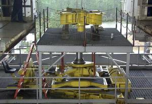 A RS-25 thrust frame adapter is positioned into place for mounting onto the A-1 Test Stand at NASA’s Stennis Space Center.