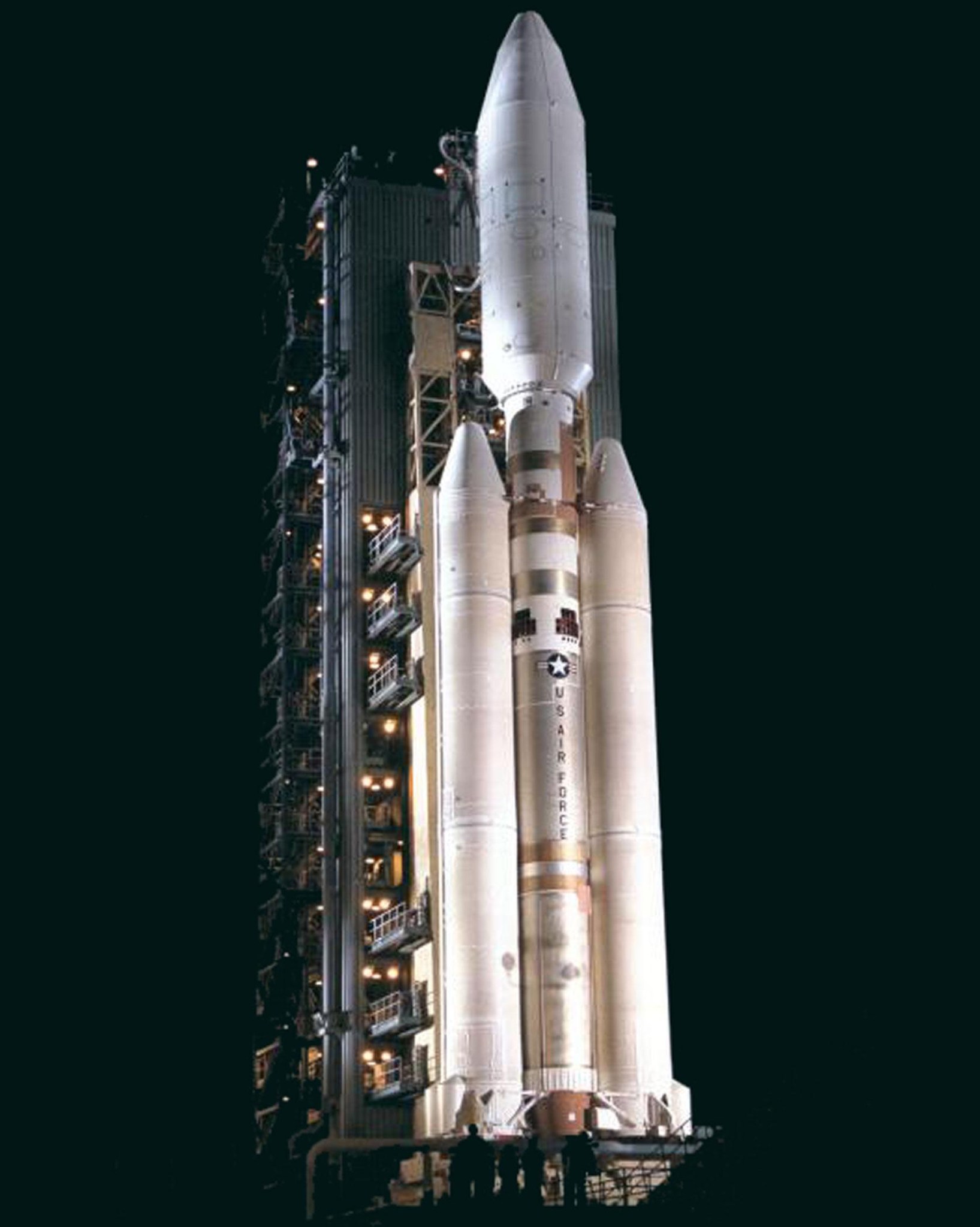 Rocket on launch pad at night.