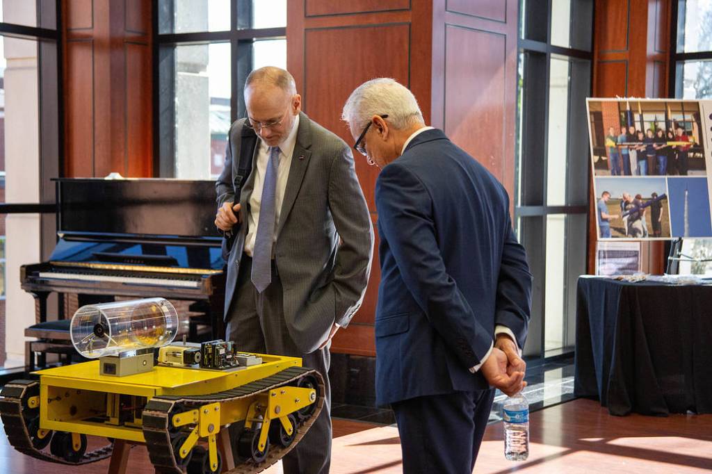 NASA’s Douglas Terrier and David Steitz Investigate a Rover at Arkansas’ Harding University