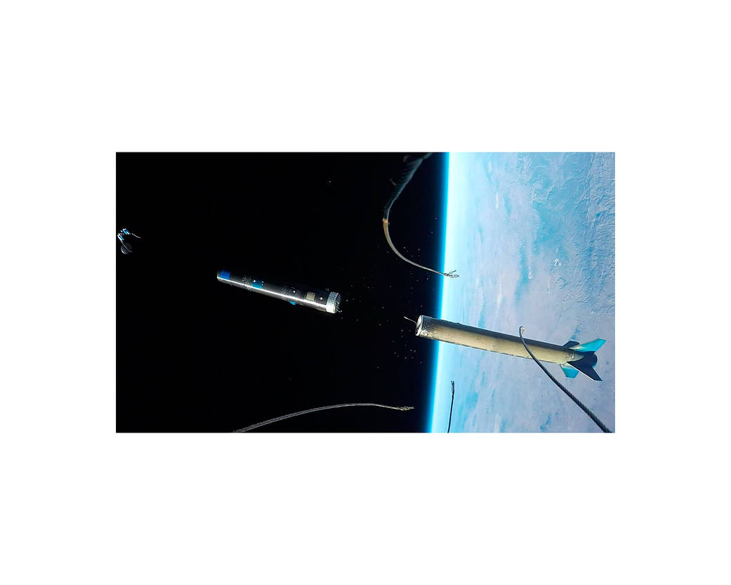 Nose fairing camera view of an UP Aerospace booster separating in space and ejecting the Maraia capsule.
