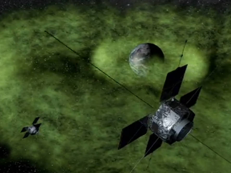 Artist's rendition of Earth's radiation belts with the twin Van Allen Probes traveling through them.