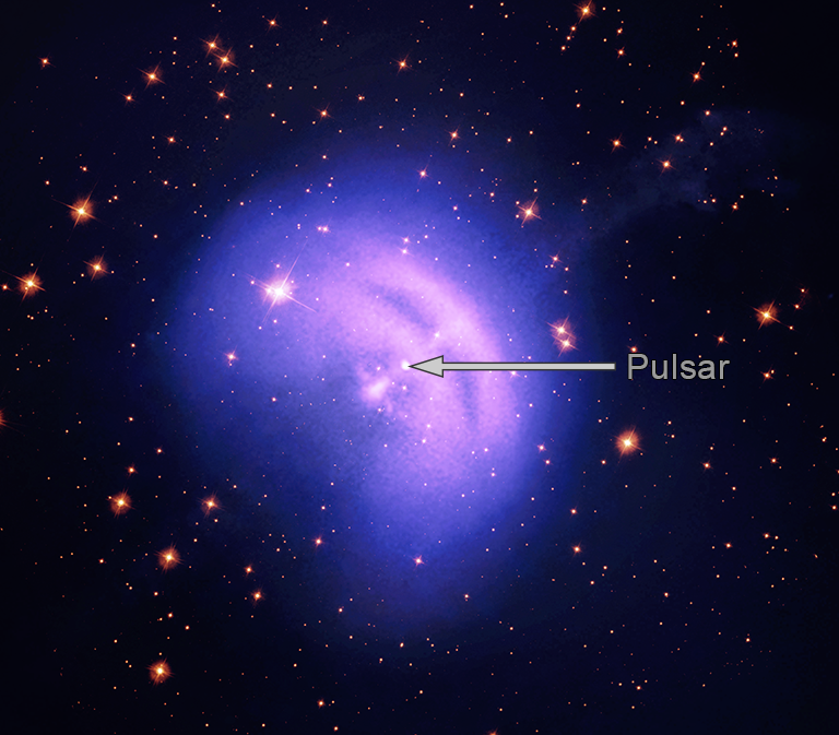 Vela Pulsar Wind Nebula is a bright white dot in a purple/blue hazy circle. The space surrounding it is black with several orange colored stars in the background.