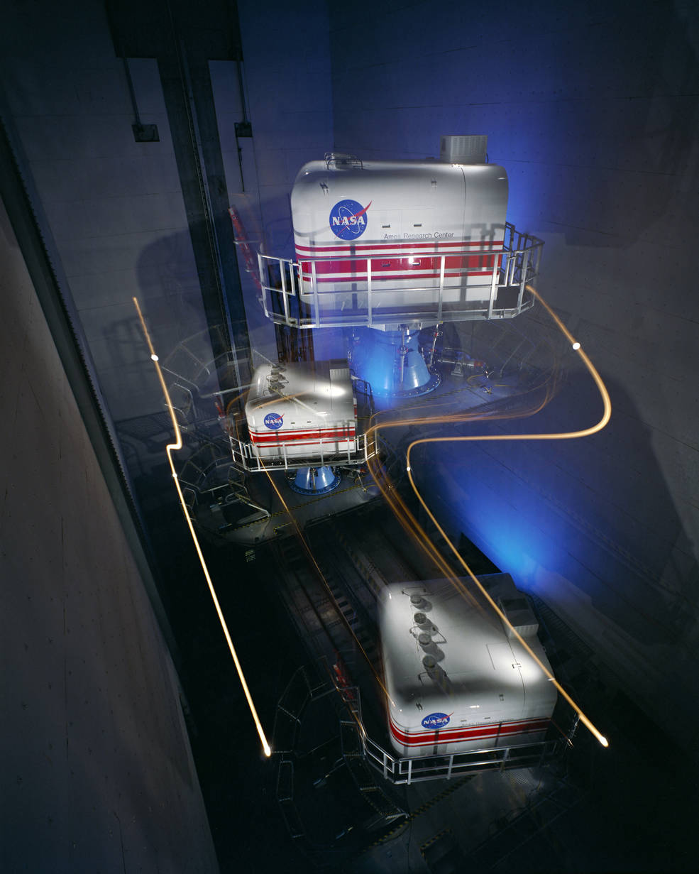 Multiple exposure of the vertical motion simulator at Ames Research Station showing some of its range of motion.