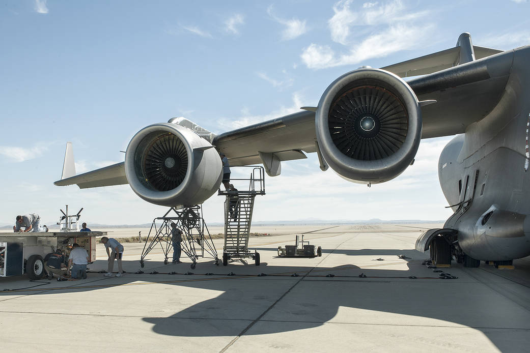 NASA researchers set up to run volcanic ash through an F117 engine mounted on a C-17 cargo transport at Edwards Air Force base.